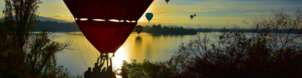 A hot air balloon above a lake